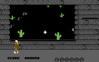 Indian Attack (Commodore 64) screenshot: Shoot the Indian before he scalps someone