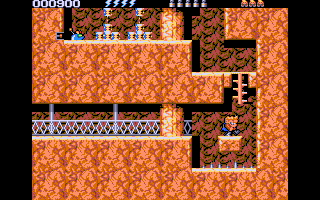Rick Dangerous 2 (DOS) screenshot: Carefully crossing the pit of spikes at the headquarter's entrance (VGA)
