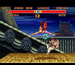 Street Fighter II Turbo (SNES) screenshot: Vega, the ninjitsu "master", attacking Ryu with your aerial move.