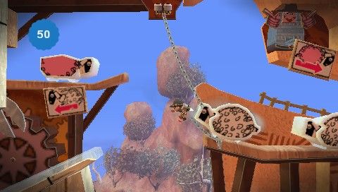 LittleBigPlanet (PSP) screenshot: A minigame involving catching and transporting sheep