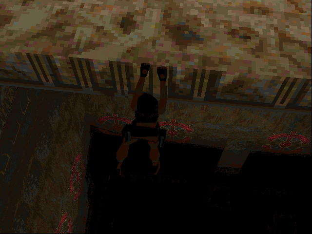 Tomb Raider (DOS) screenshot: What could keep Lara dangling on the edge of this bottomless pit ? Play the game and find out, you lazy bums!