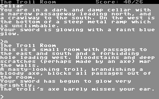 Zork: The Great Underground Empire (Commodore 64) screenshot: Facing a troll