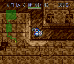 Torneko no Daibōken: Fushigi no Dungeon (SNES) screenshot: Armed with axe and shield, Torneko ventures down a narrow passageway